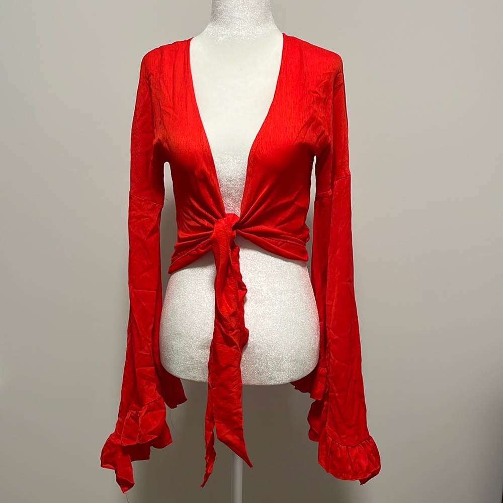 Red long sleeve low cut wrap top